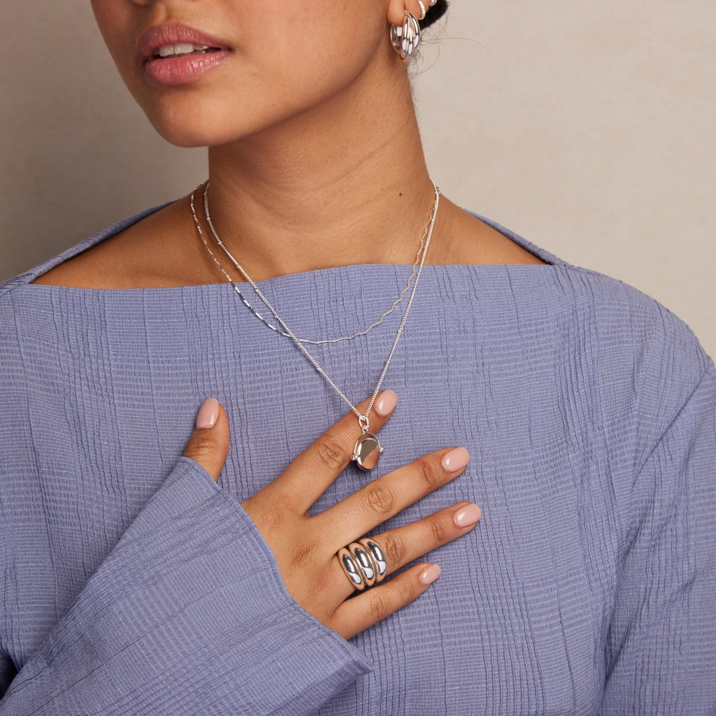 LUXE Leo Engraved Faceted Disc Spinner Necklace - Silver